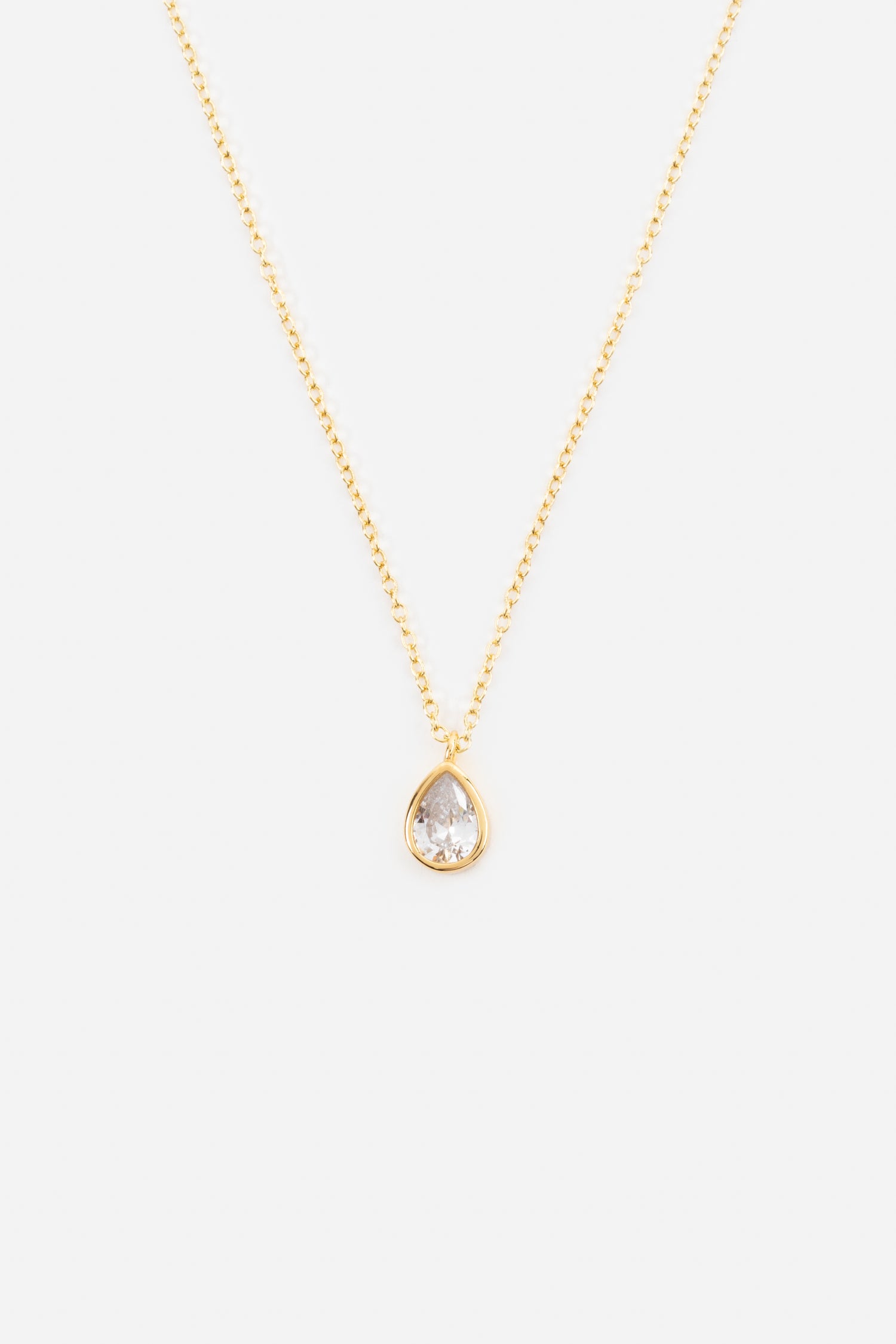 teardrop pendant with a cubic zirconia insert on a gold plated chain necklace